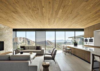 Nowoczesny salon podzielony na strefy wypoczynku, jadalni i domowego biura