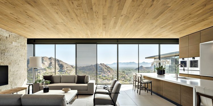 Nowoczesny salon podzielony na strefy wypoczynku, jadalni i domowego biura