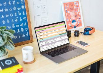 ekran laptopa z arkuszem Excela wyświetlającym kosztorys budowlany z materiałami i sumami